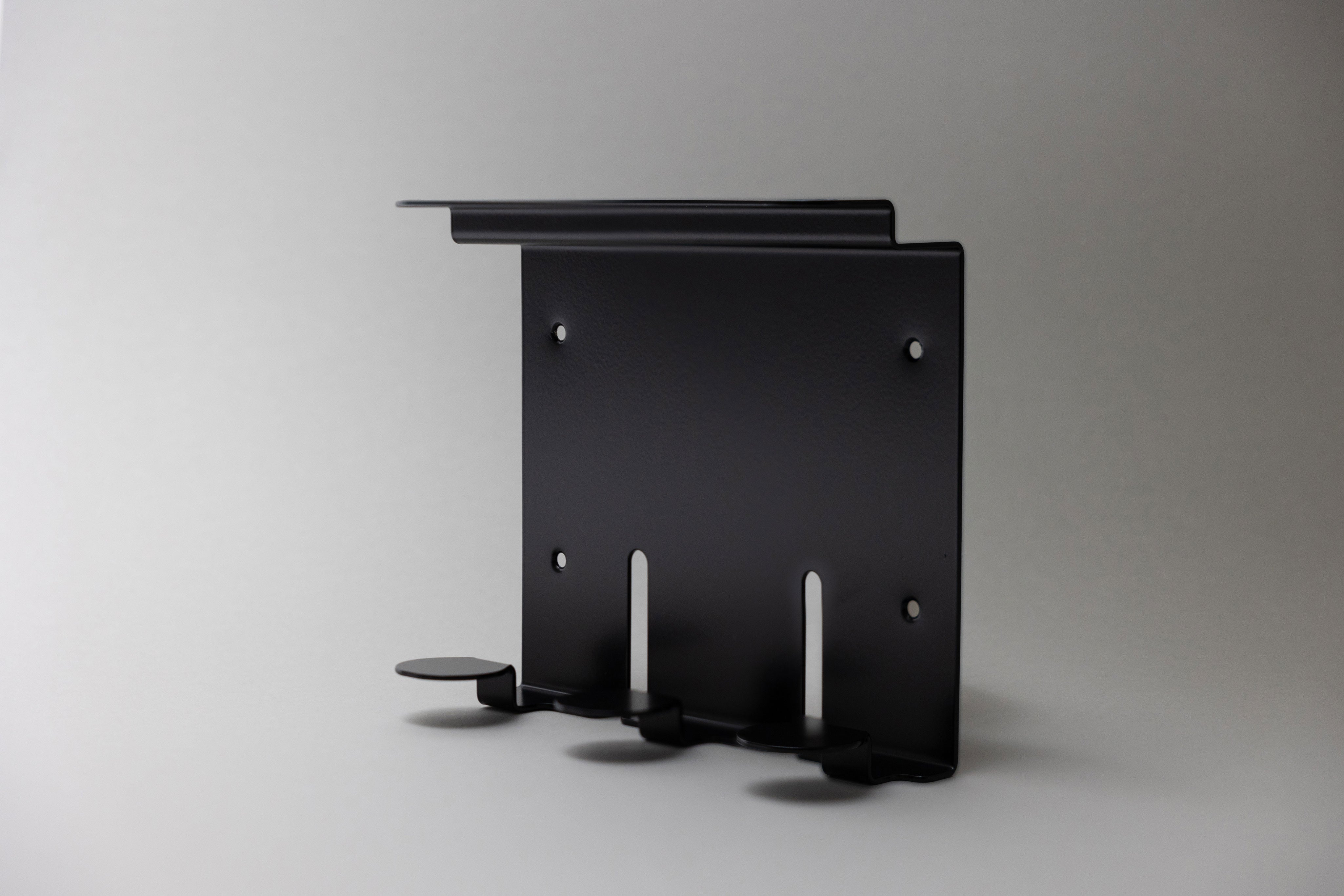 A black triple metal holder for bathroom essentials to triple up on storage and for better bathroom organisation, aesthetic and functional.