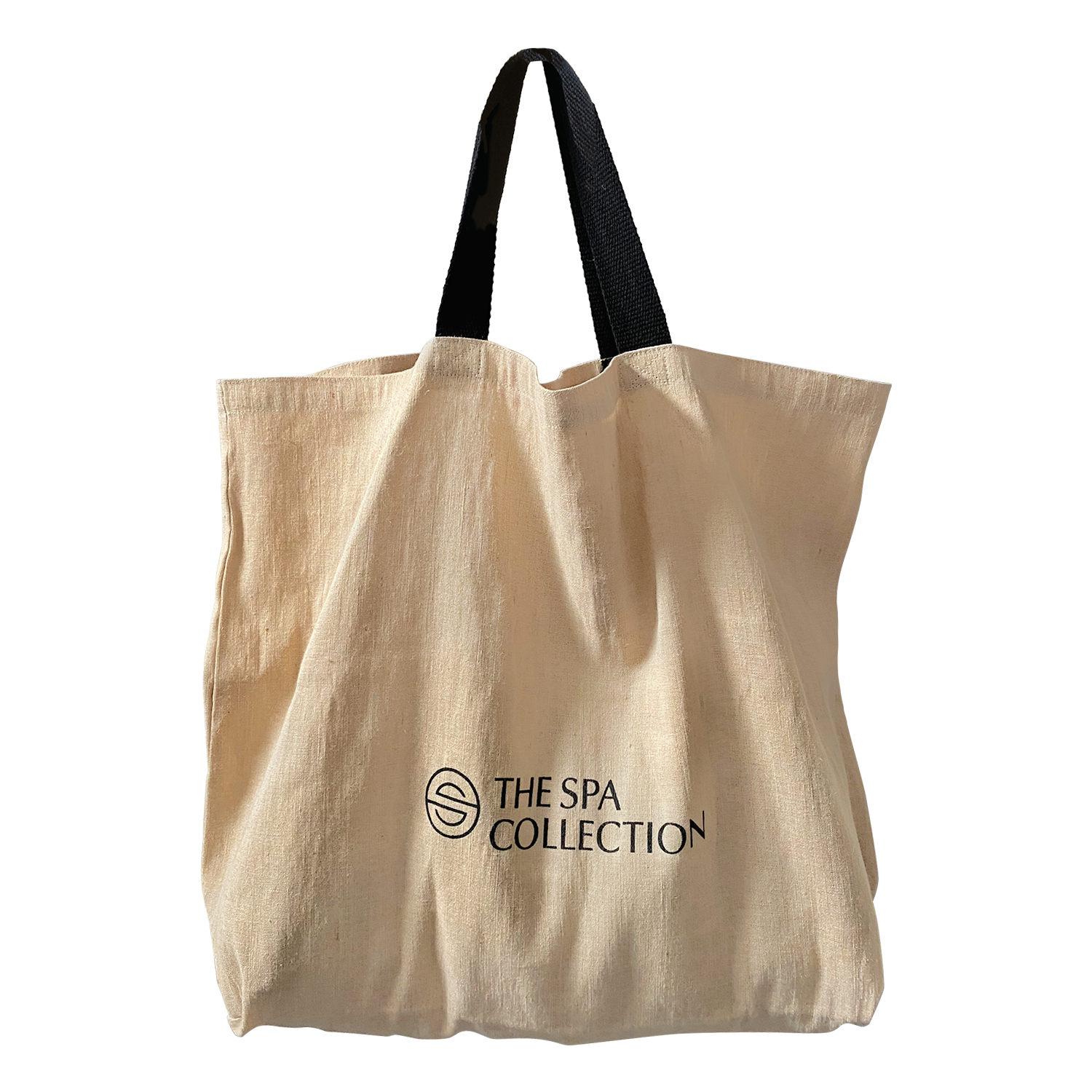 A beige, stylish and sustainable jute beach bag with The Spa Collection logo in black. Stylish and functional, eco-friendly bag.